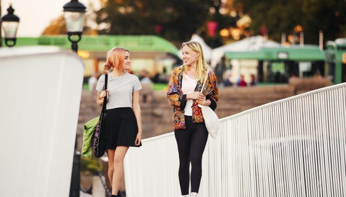 Young women walking outdoors
